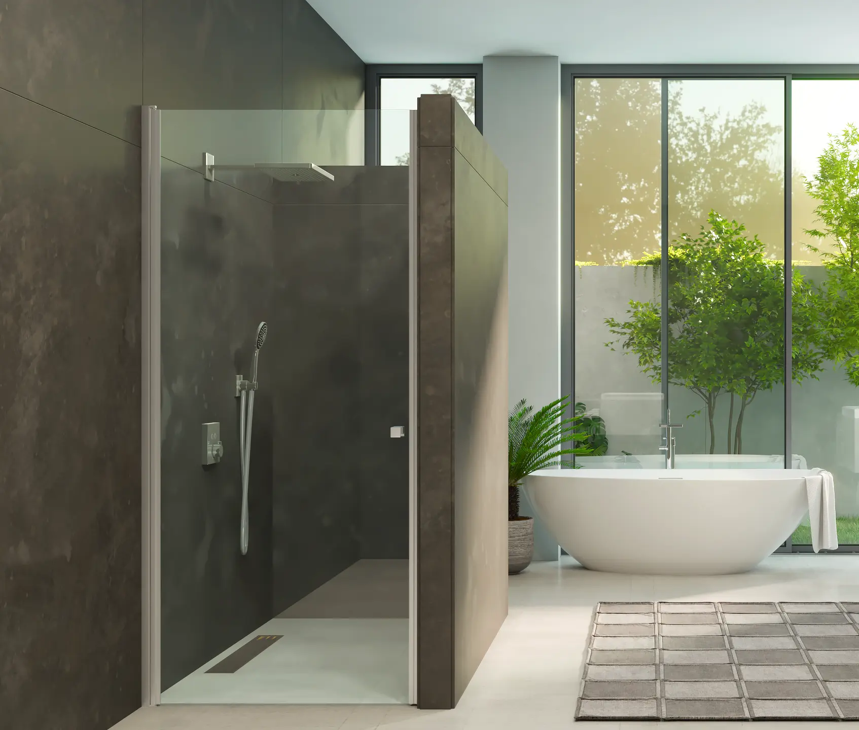 Glasdusche Anna in Edelstahl in einer Nische im Badezimmer. Eine Wanne im Hintergrund